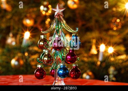 Decoration Glass Christmas Tree in Front of Christmas Tree Stock Photo