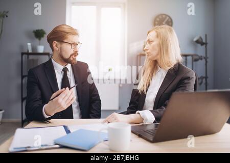 Two business partners discussing new project at work Stock Photo