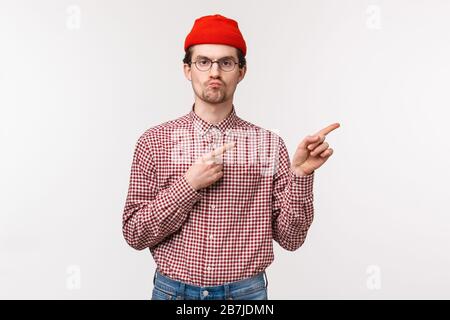 young geeky man in red beanie 