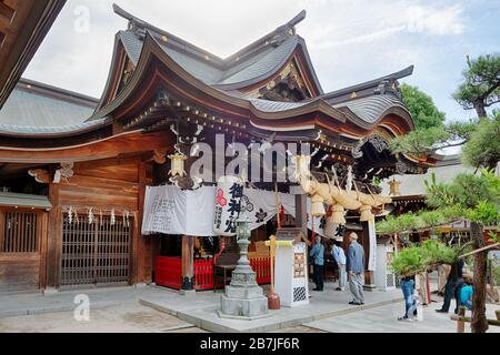 Fukuoka, Japan, May 25 2020, people praying in Kushida Shinto shrine in Japan. This shrine is one of the most famous and old in Hakata district of Fuk Stock Photo