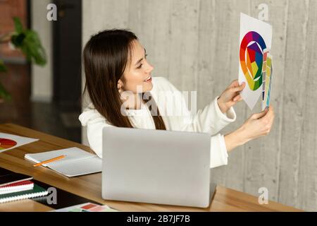 Remote work concept. Designer demonstrates color swatch Stock Photo