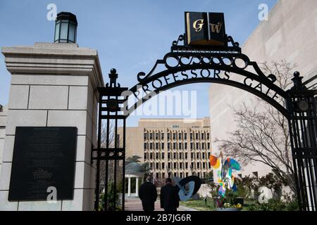 Washington, USA. 16th Mar, 2020. Two people walk through an empty Kogan Plaza at the George Washington University in Washington, DC, on March 16, 2020. Last week, most universities in the city sent students home for the remainder of the Spring semester and on Sunday the Centers for Disease Control and Prevention recommended cancelling all events of 50 people or more in the United States for the next eight weeks, in an attempt to slow the spread of the ongoing COVID-19 coronavirus outbreak. (Graeme Sloan/Sipa USA) Credit: Sipa USA/Alamy Live News Stock Photo