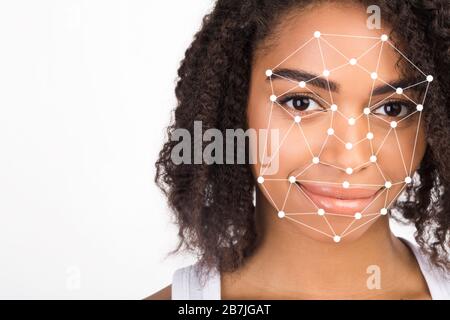 Recognition of African American woman's face by layering a mesh, isolated on white. Blank space Stock Photo