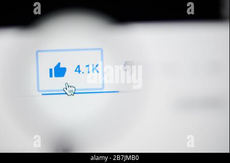 New-York , USA - March 13, 2020: Press like button on youtube clip on laptop screen close up view Stock Photo