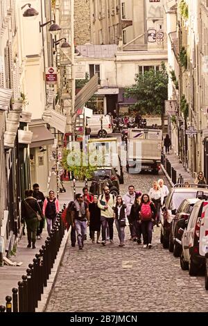 tourists climbing Rue Tholoze Montmartre Paris France Stock Photo