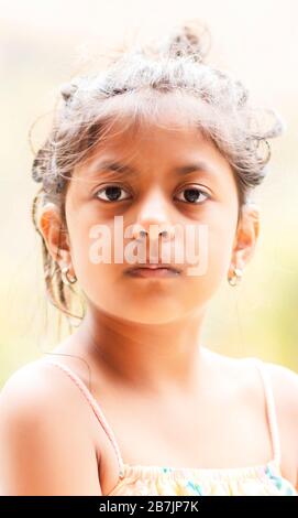 Portrait of cute little girl showing her beautiful face Stock Photo