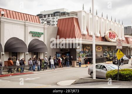 Line of shoppers wait outside a Ralph's grocery store to prepare for corona virus outbreak Stock Photo