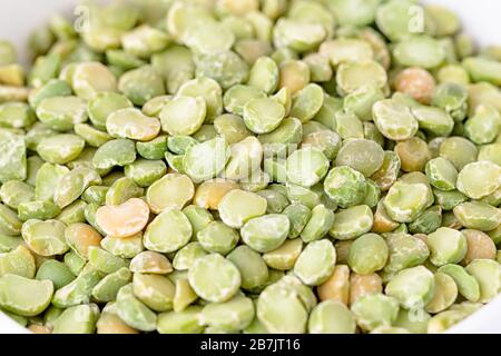 Dry split light green peas texture background Stock Photo