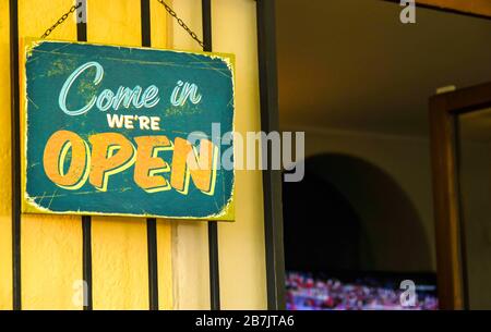 "We're open" sign outside a cafe bar in Europe Stock Photo