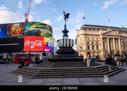 London, UK. 16th March 2020. Corona virus: The statue of Eros at Piccadilly Circus, normally a focal point for visitors to London is uncommonly quiet as people stay away from the city centre. Stock Photo