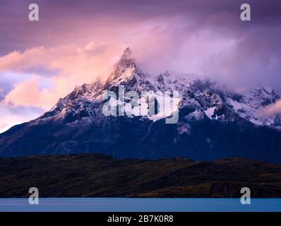 NATIONAL PARK TORRES DEL PAINE, CHILE - CIRCA FEBRUARY 2019: Sunset over the Paine Mountain Range in Torres del Paine National Park, Chile. Stock Photo