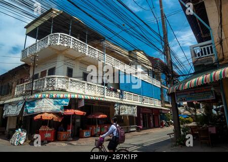Battambang, Cambodia, Asia: colonial style building in the center of Battambang surrounded by electric cables Stock Photo