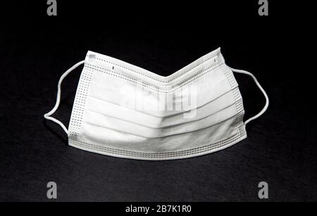 Protective face mask on black  background Stock Photo