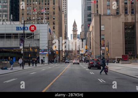 Toronto, Canada. 16th March 2020. Toronto experience a light evening rush hours as many Toronto major streets are nearly empty due to COVID-19 closures with many employees working from home. In picture, Toronto's Bay Street is nearly empty.  Dominic Chan/EXImages Credit: EXImages/Alamy Live News Stock Photo
