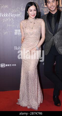 Canadian actress and restauratrice Christy Chung, left, attends a promotional event of Robb Report, a luxury magazine with husband Lunshuo Zhang in Be Stock Photo