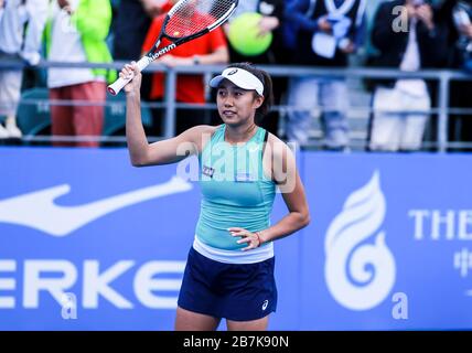 Chinese professional tennis player Zhang Shuai celebrates after defeating Polish professional tennis player Magda Linette during the first round of 20 Stock Photo