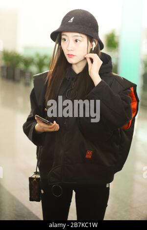 Chinese actress Zhu Xudan or Bambi Zhu arrives at a Beijing airport before departure in Beijing, China, 17 January 2020. Jacket: Off-White Hat: Kangol Stock Photo