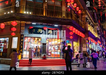 Pedestrians walk in Qianmen Walking Street where all lights turn on to celebrate the upcoming Spring Festival, Beijing, China, 20 January 2020. *** Lo Stock Photo