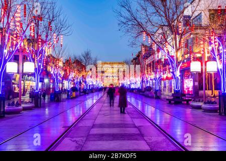 Pedestrians walk in Qianmen Walking Street where all lights turn on to celebrate the upcoming Spring Festival, Beijing, China, 20 January 2020. *** Lo Stock Photo