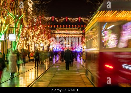 Pedestrians walk in Qianmen Walking Street where all lights turn on to celebrate the upcoming Spring Festival, Beijing, China, 20 January 2020. *** Lo Stock Photo