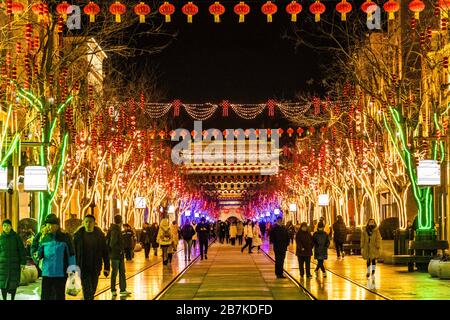 Pedestrians walk in Qianmen Walking Street where all lights turn on to celebrate the upcoming Spring Festival, Beijing, China, 20 January 2020. *** Lo Stock Photo