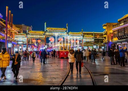 Pedestrians walk in Qianmen Walking Street where all lights turn on to celebrate the upcoming Spring Festival, Beijing, China, 20 January 2020. *** Lo Stock Photo