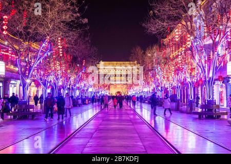 Pedestrians walk in Qianmen Walking Street where all lights turn on to celebrate the upcoming Spring Festival, Beijing, China, 20 January 2020. *** Lo Stock Photo