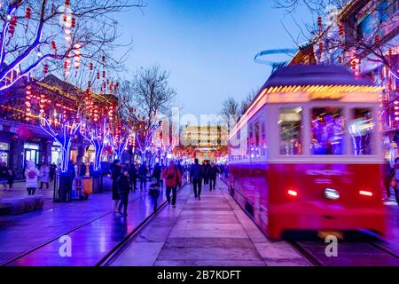 Pedestrians walk in Qianmen Walking Street where all lights turn on to celebrate the upcoming Spring Festival, Beijing, China, 20 January 2020. *** Lo Stock Photo