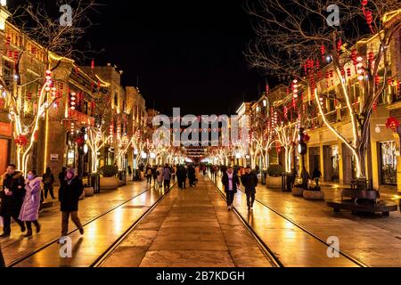 Pedestrians walk in Qianmen Walking Street where all lights turn on to celebrate the upcoming Spring Festival, Beijing, China, 20 January 2020. *** Lo Stock Photo