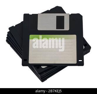Stacked floppy disks / diskettes isolated on white background. Floppy disc with blank sticker on top. Stock Photo