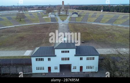 Oranienburg, Germany. 04th Mar, 2020. Entrance to the prisoners' camp with 'Tower A' on the grounds of the Sachsenhausen memorial (aerial photo taken with a drone). The accommodation barracks were built in four rows around the semicircular roll call area. The Sachsenhausen concentration camp was built by prisoners in summer 1936. Credit: Patrick Pleul/dpa-Zentralbild/ZB/dpa/Alamy Live News Stock Photo