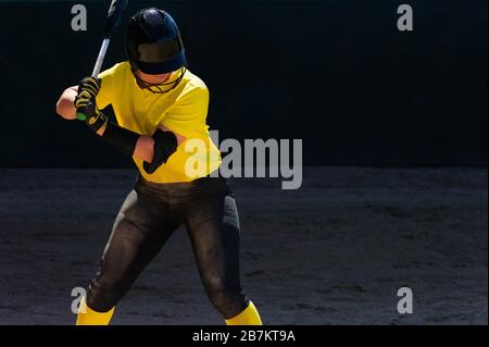 A Female Baseball Player is Batting During Tournament Play Stock Photo