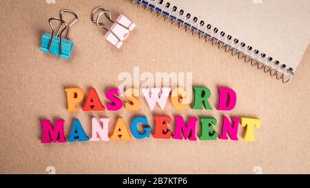 Password Management. Colorful wooden letters on cardboard background Stock Photo