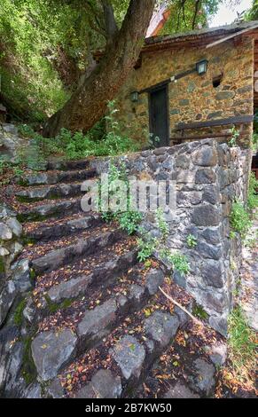 The view of the stone steps  leading to the old watermill Milos tis Gonias on the river  Clarios in the Kakopetria village. Nicosia District. Cyprus Stock Photo