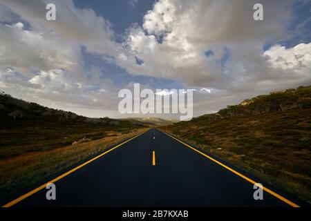 Alpine road with yellow lines Stock Photo