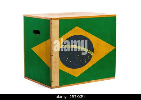 A wooden box for reliable shipment of various goods and cargo with the national flag of Brazil on a white isolated background. The concept of export-i Stock Photo