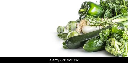 Green fresh vegetable isolated on white background. Onion cucumber peas broccoli zucchini and other healthy vegetables Stock Photo