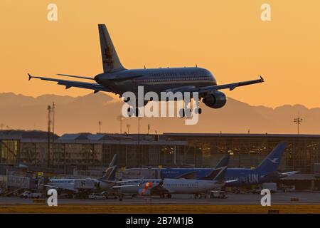 Richmond, British Columbia, Canada. 16th Mar, 2020. An Air Canada Airbus A319-114 (C-FZUH) jet, painted in special retro TCA livery, lands at sunset, Vancouver International Airport, Richmond, B.C., Canada on Monday, March 16, 2020. Earlier in the day the Canadian Government, in an effort to stop the spread of the novel coronavirus, announced that the nation's borders would be closed starting Wednesday, March 18 to all travelers other than Canadian citizens and permanent residents, U.S. citizens, and diplomats and essential workers. Credit: Bayne Stanley/ZUMA Wire/Alamy Live News Stock Photo