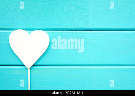 White heart on a wooden blue background. Valentine's Day. Place for text Stock Photo