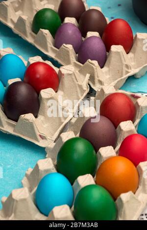 Multicolored painted Easter eggs in cardboard container Stock Photo