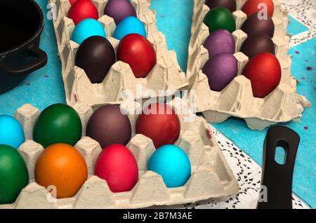 Multicolored painted Easter eggs in cardboard container Stock Photo