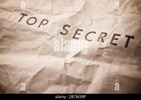 Top secret sentence on a brown paper. Stock Photo