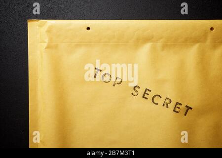 Top secret sentence on a brown envelope. Stock Photo