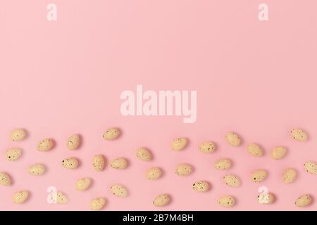 Frame made of easter eggs on a pink pastel background. Holiday creative concept. Stock Photo