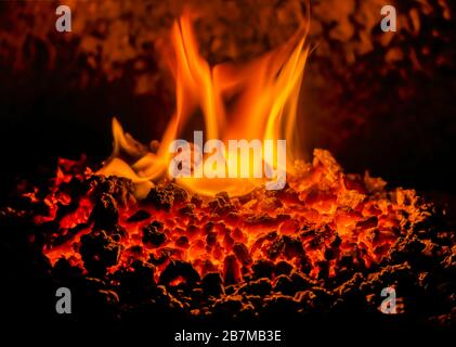 Coal fire with hot embers, close-up. Stock Photo