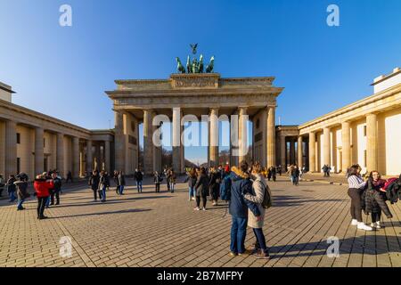 Berlin, Germany - February 9, 2020: Tourists near the Brandenburg Gates or Brandenburger Tor Stock Photo
