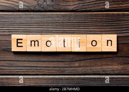emotion word written on wood block. emotion text on table, concept. Stock Photo