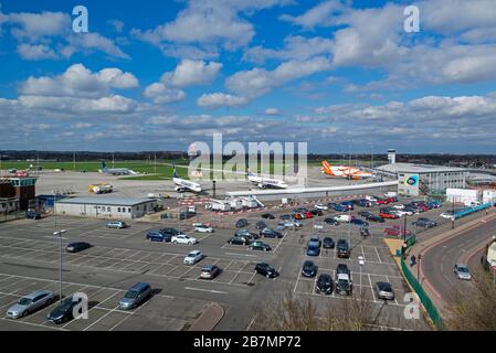 An aerial view of London Southend Airport, Essex, UK, with car parks more empty than usual due to COVID-19 Coronavirus. Planes parked up Stock Photo