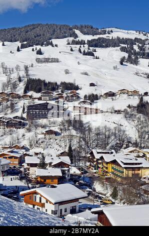 Saalbach, Austria - February 18, 2013: Unidentified people, buildings and homes in ski resort Saalbach-Hinterglemm in Salzburg Stock Photo