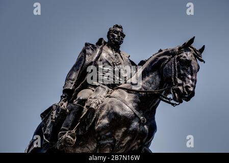 Lima, Peru - April 18, 2018: Close up of statue of General San Martin on horseback located in Plaza San Martin with blue sky as background. Stock Photo